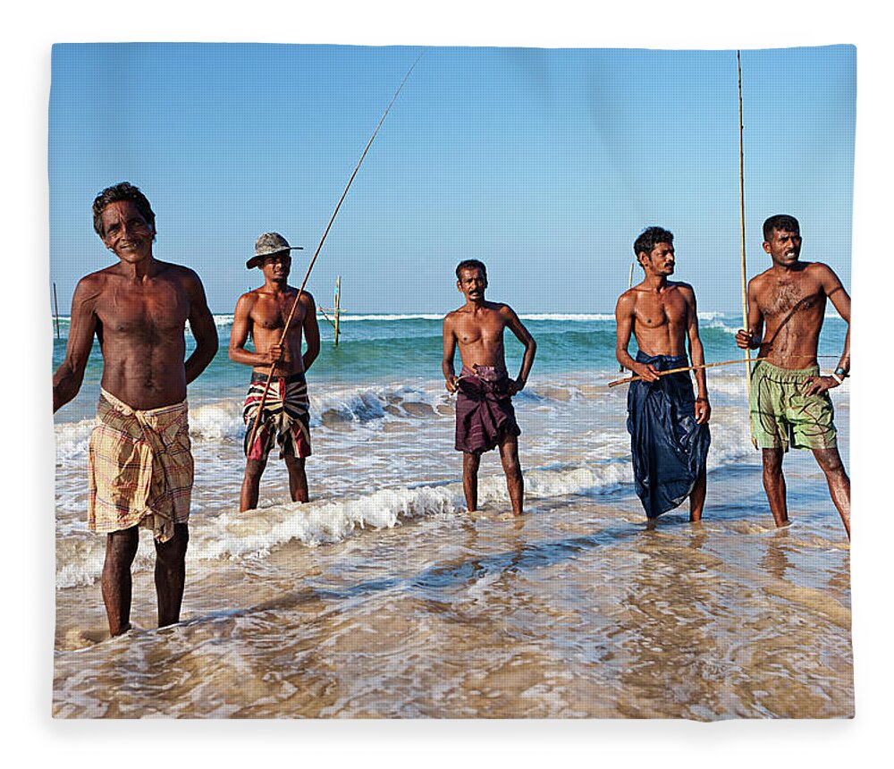 Working Fleece Blanket featuring the photograph The Stilt Fishermen At Work, Sri Lanka #1 by Hadynyah