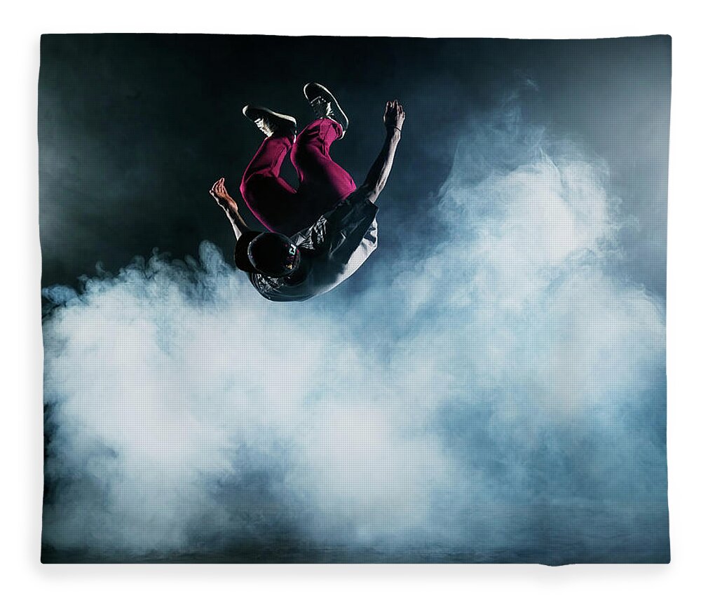 Copenhagen Fleece Blanket featuring the photograph Dancer Leaping Through Smoke #2 by Henrik Sorensen