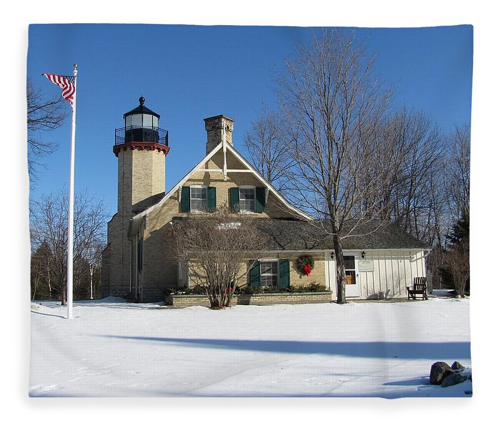 Winter Fleece Blanket featuring the photograph McGulpin Point Lighthouse in Winter by Keith Stokes