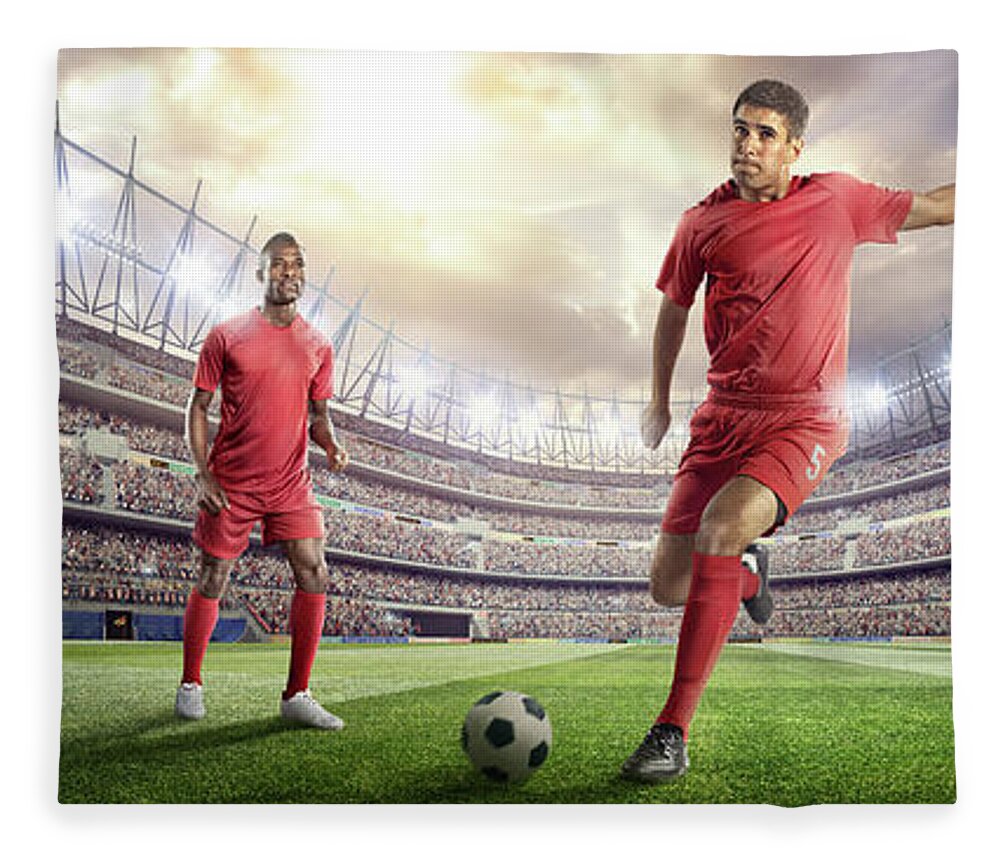 Soccer Uniform Fleece Blanket featuring the photograph Soccer Player Kicking Ball In Stadium #6 by Dmytro Aksonov
