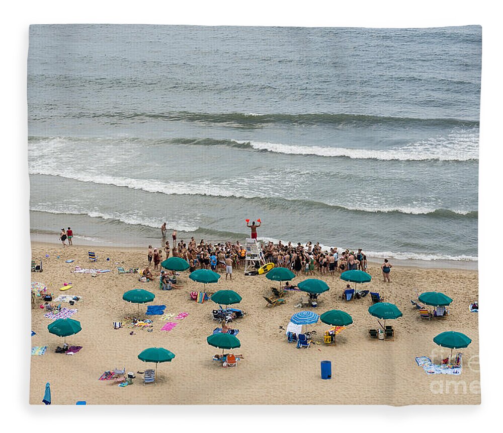 Atlantic Fleece Blanket featuring the photograph A lifeguard gives a safety briefing to beachgoers in Ocean City Maryland by William Kuta