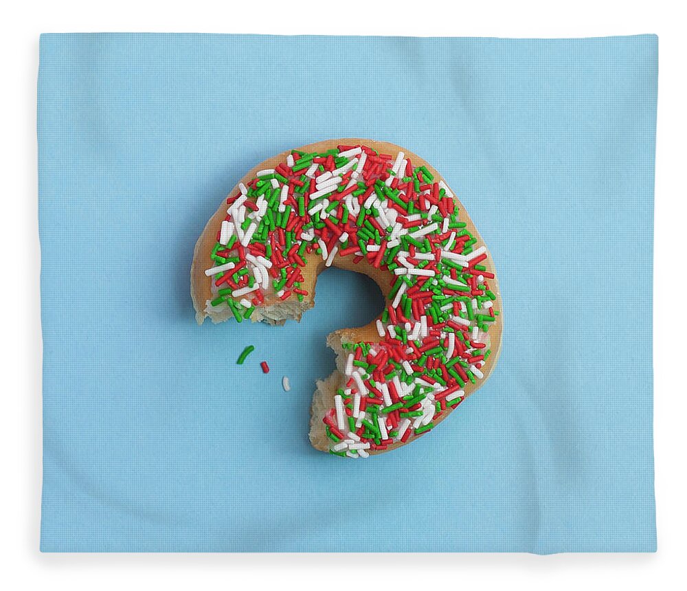 Unhealthy Eating Fleece Blanket featuring the photograph Bite Out Of A Sprinkle Donut, On A Blue by Steven Errico