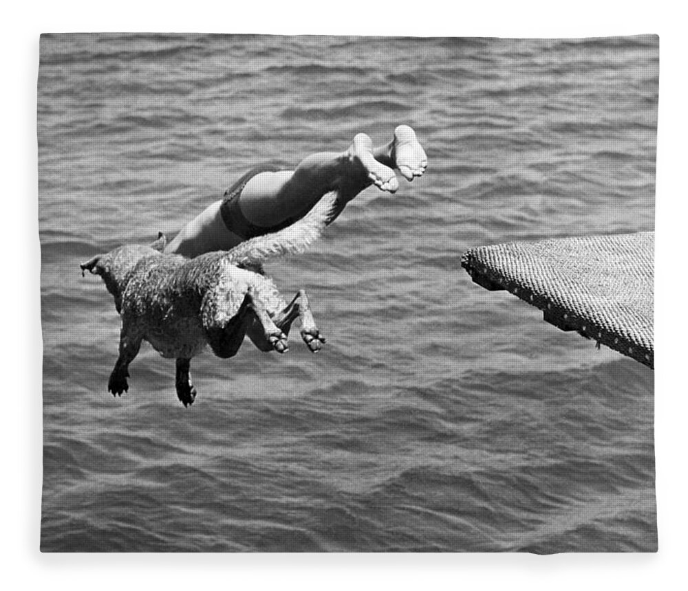 1940 Fleece Blanket featuring the photograph Boy And His Dog Dive Together by Underwood Archives