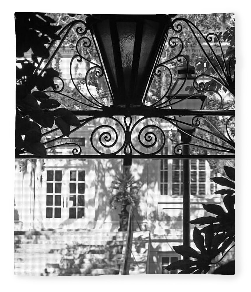 Lantern Fleece Blanket featuring the photograph Charleston Gateway II in Black and White by Suzanne Gaff