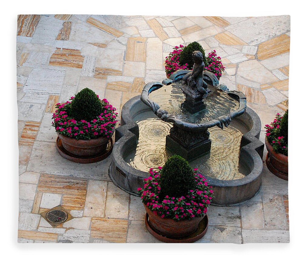 Mission Inn Fleece Blanket featuring the photograph Courtyard Rippling Water by Amy Fose