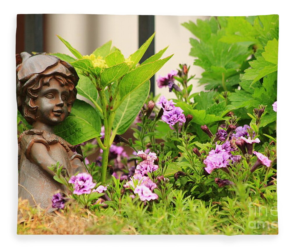 Angel Fleece Blanket featuring the photograph Flower-bed mit an angel statue by Amanda Mohler