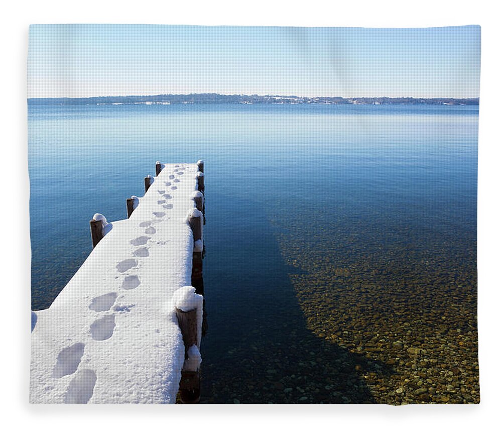 Tranquility Fleece Blanket featuring the photograph Footprints On Snow Covered Pier by Henglein And Steets