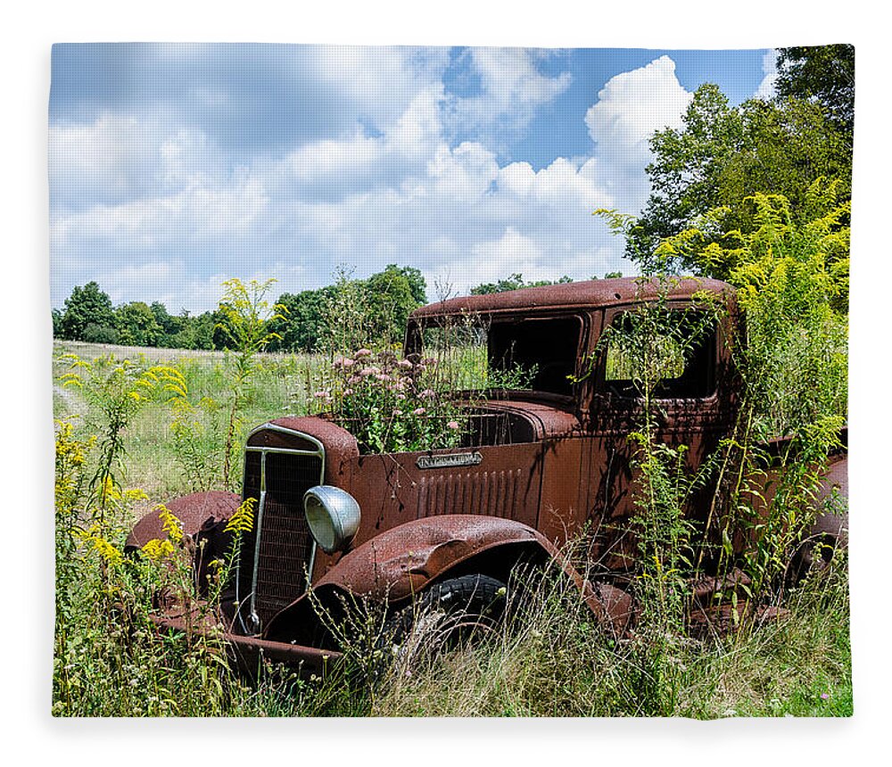 Rusty Truck Fleece Blanket featuring the photograph Recycled Planter by Georgette Grossman