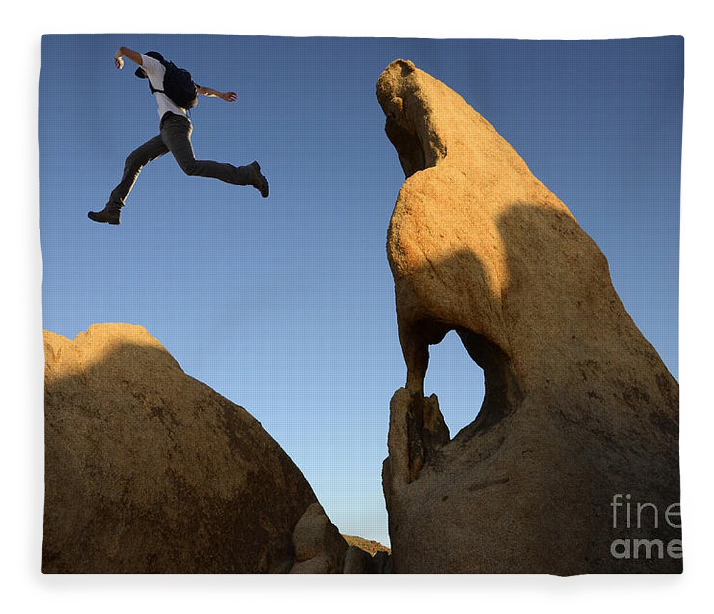 Leap Fleece Blanket featuring the photograph Leap Of Faith by Bob Christopher