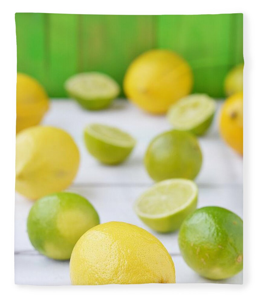 Large Group Of Objects Fleece Blanket featuring the photograph Lemon And Lime by Zoryana Ivchenko