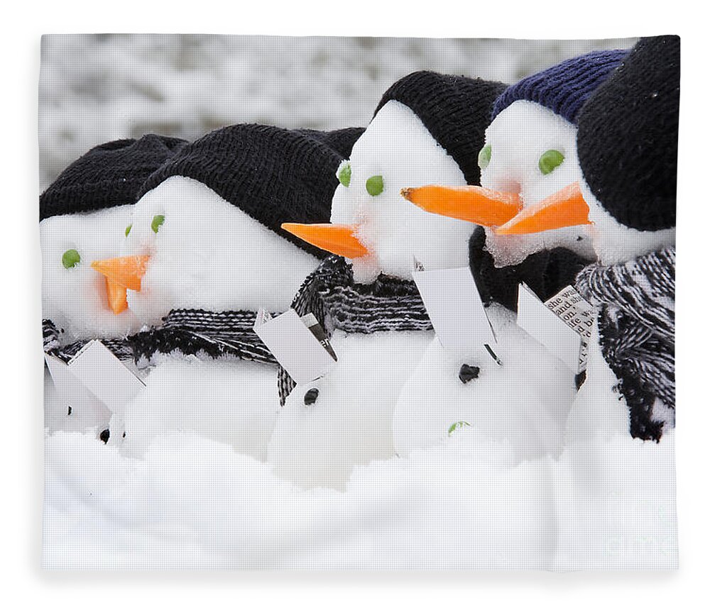Snowmen Fleece Blanket featuring the photograph Line of carol singing snowmen by Simon Bratt