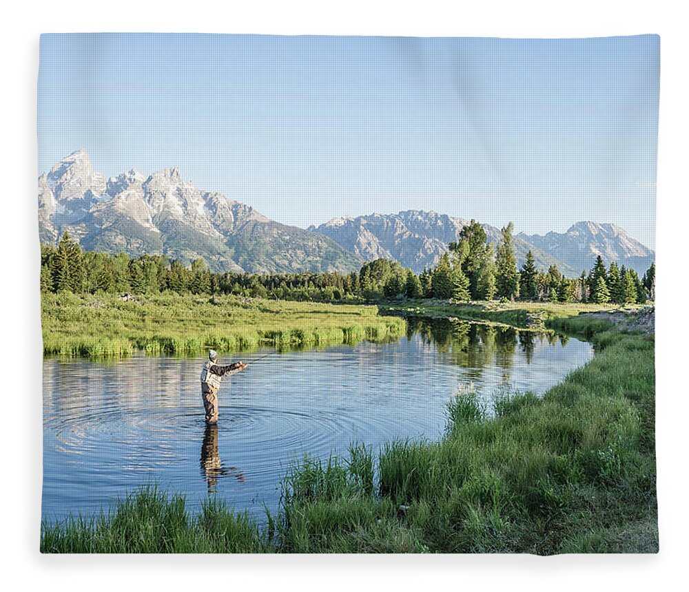 https://render.fineartamerica.com/images/rendered/default/flat/blanket/images-medium-5/man-fly-fishing-in-snake-river-in-grand-the-open-road-images.jpg?&targetx=-124&targety=0&imagewidth=1200&imageheight=800&modelwidth=952&modelheight=800&backgroundcolor=B1CFED&orientation=1&producttype=blanket-coral-50-60