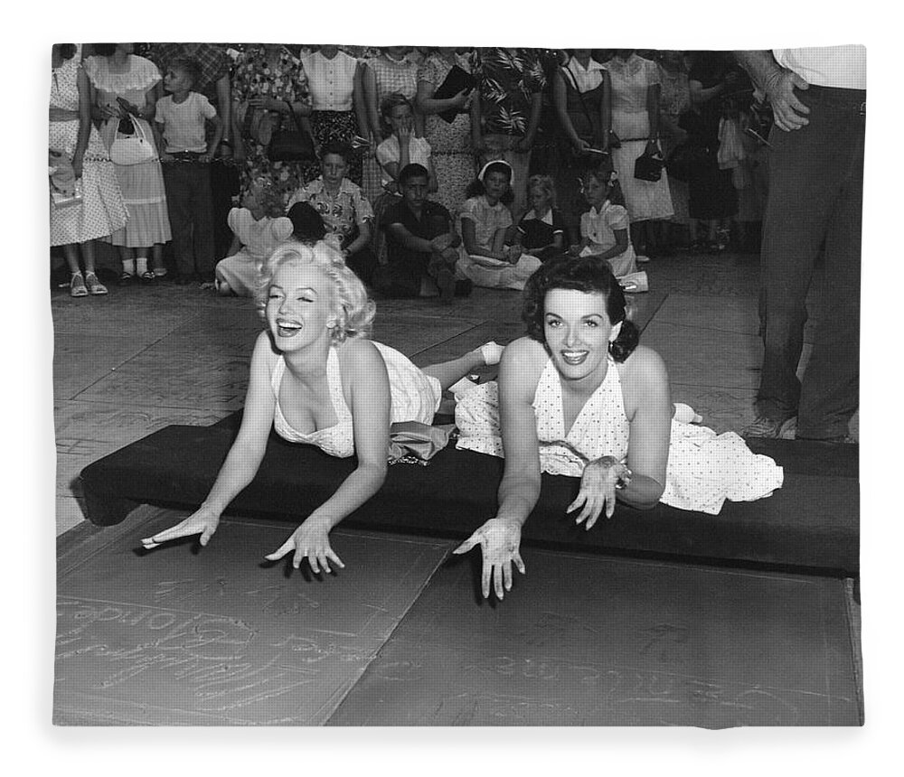 1950's Fleece Blanket featuring the photograph Marilyn Monroe And Jane Russell by Underwood Archives