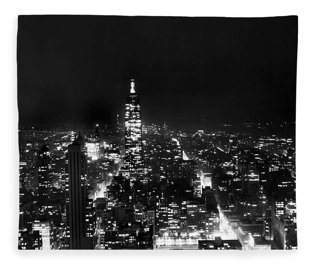 1945 Fleece Blanket featuring the photograph Midtown Manhattan At Night by Underwood Archives