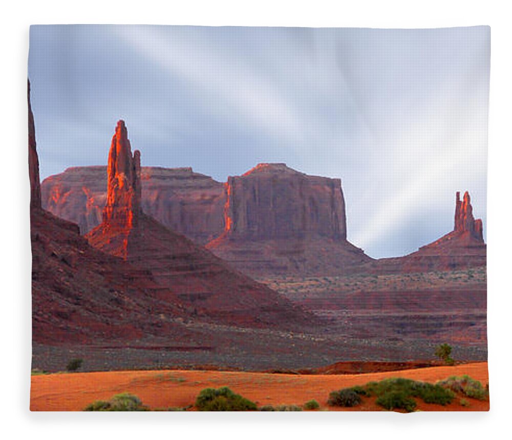 Desert Fleece Blanket featuring the photograph Monument Valley at Sunset Panoramic by Mike McGlothlen