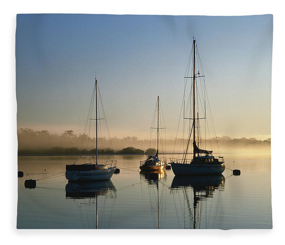 Sailboat Fleece Blanket featuring the photograph Moored Boats At Sunrise by Richard I'anson