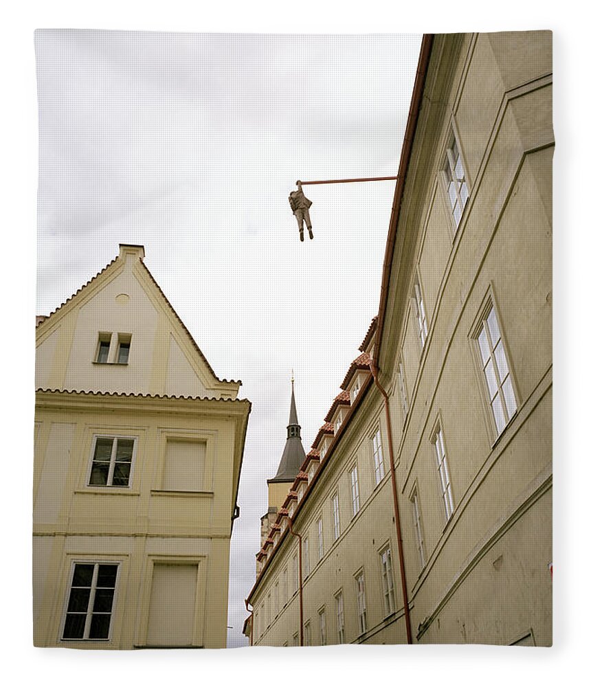 Fantasy Fleece Blanket featuring the photograph Prague's Hanging Man by Shaun Higson