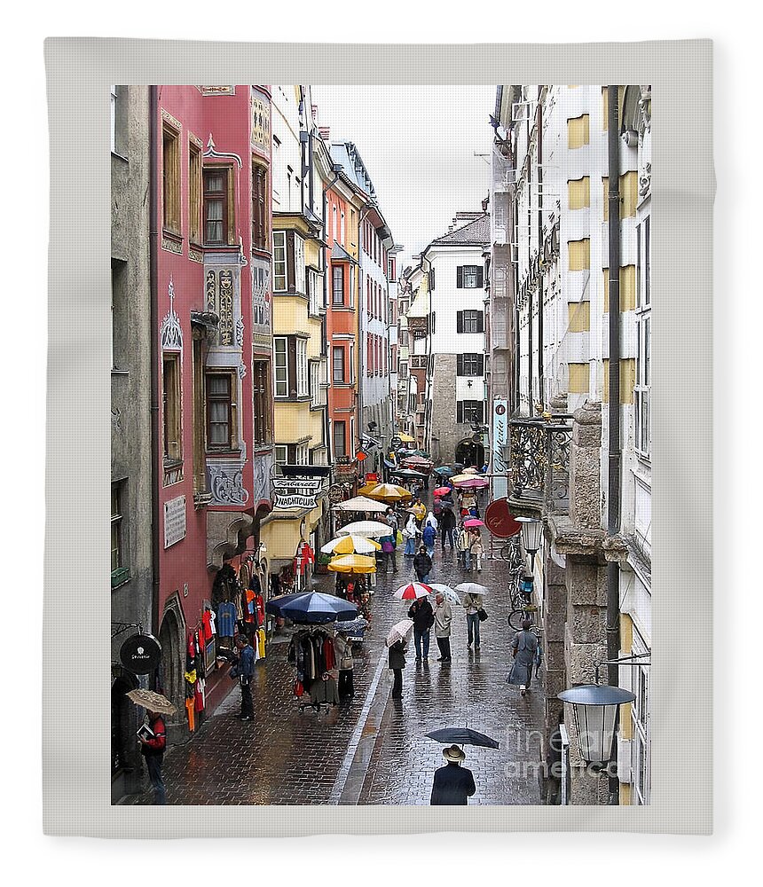 Innsbruck Fleece Blanket featuring the photograph Rainy Day Shopping by Ann Horn