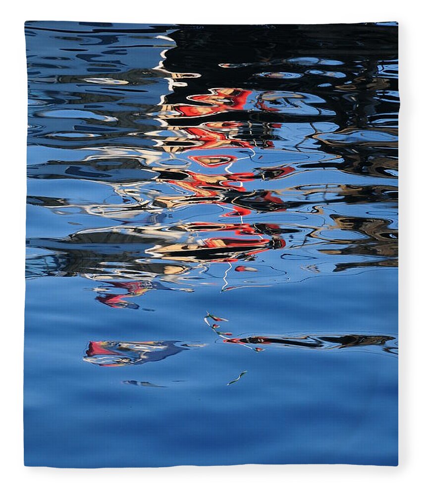 Water Reflections Red Fleece Blanket featuring the photograph Reflections in red by Susie Rieple