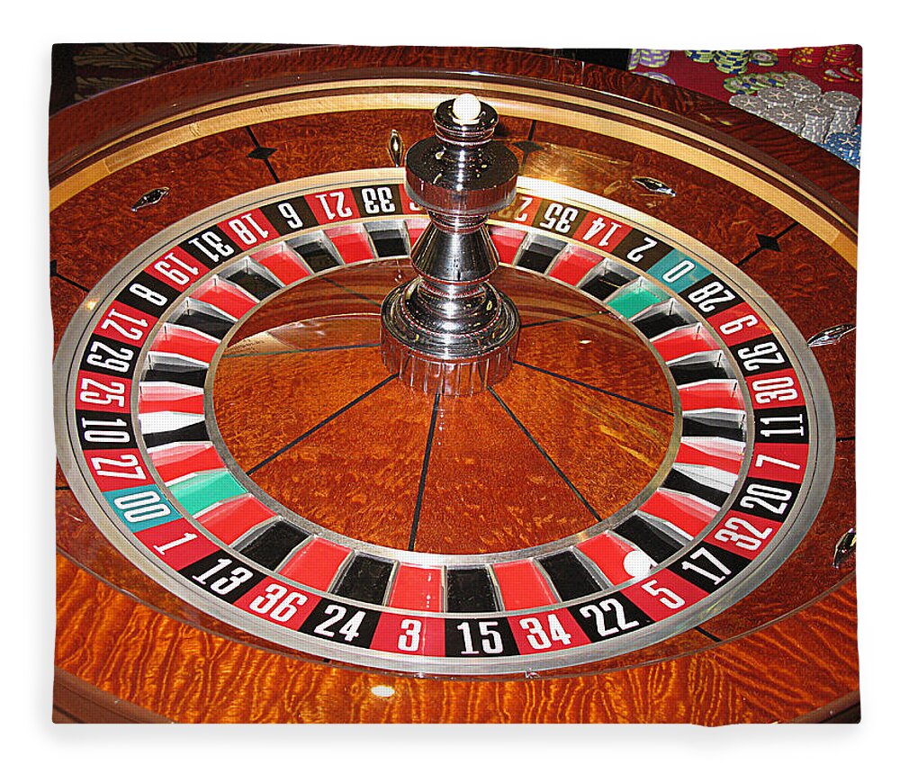 Casino Fleece Blanket featuring the photograph Roulette wheel and chips by Tom Conway