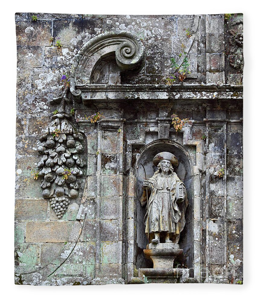 Spain Fleece Blanket featuring the photograph Disciple of Saint James Above the Holy Door by James Brunker