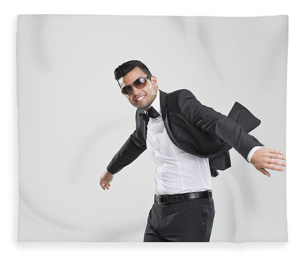 Young Men Fleece Blanket featuring the photograph Smiling Man In Tuxedo Dancing by Nils Hendrik Mueller