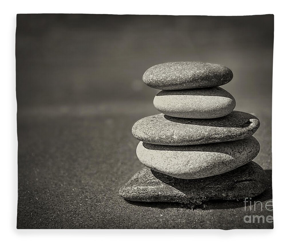 Rock Fleece Blanket featuring the photograph Stacked pebbles on beach by Elena Elisseeva