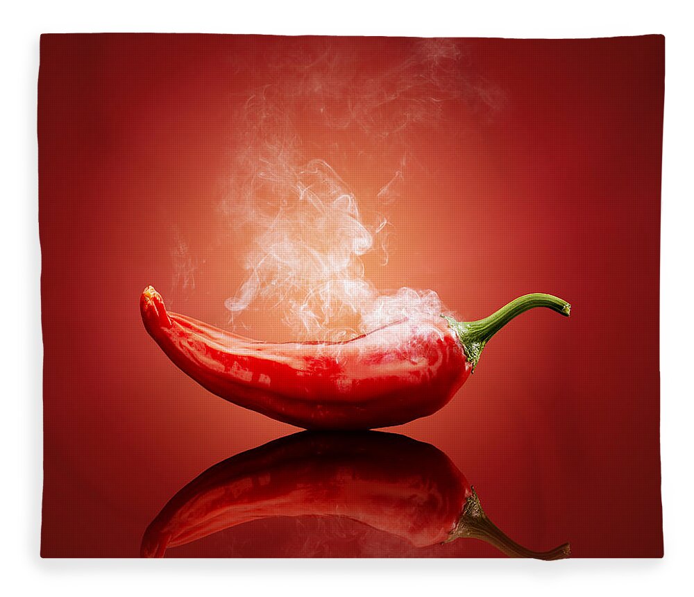 Chillichiliredsmokesmokinghotburnburningsteamsteamingcapsicumcayennejalapenopaprikapeppergradientbackgroundreflectionreflectivetablestudioshotvegetablefreshconceptconceptualstilllifefoodripeimageonenobodyphotographindoors001019xs Fleece Blanket featuring the photograph Steaming hot Chilli by Johan Swanepoel