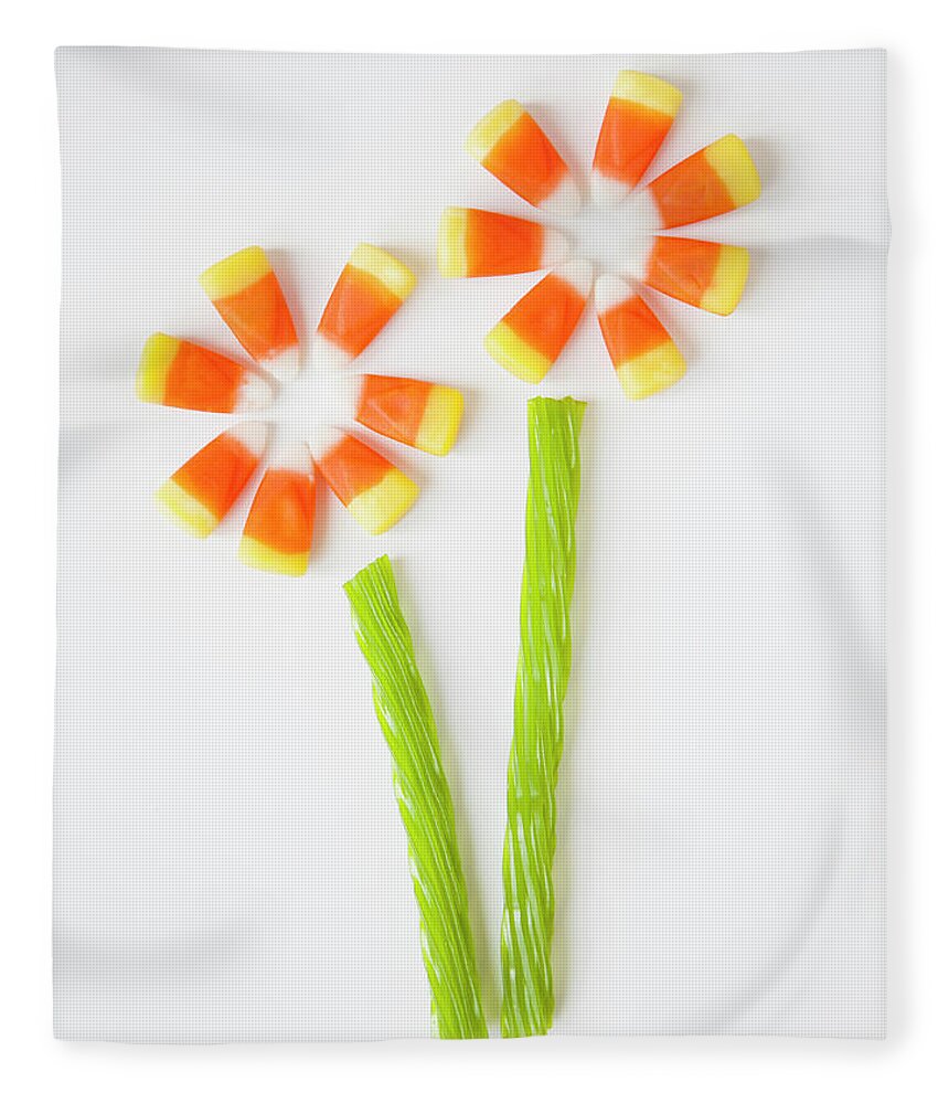 White Background Fleece Blanket featuring the photograph Studio Shot Of Candy Corn Imitating by Jessica Peterson