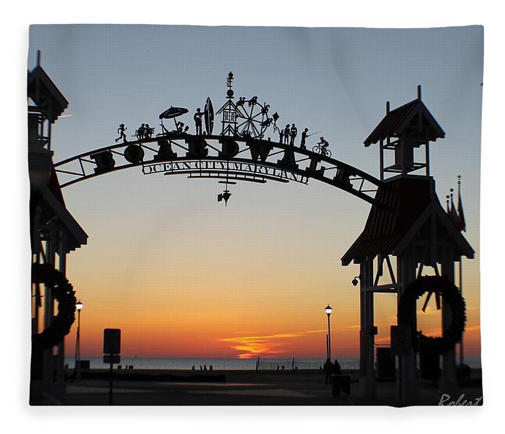 Sunrise Fleece Blanket featuring the photograph Sun Reflecting on Clouds Ocean City Boardwalk Arch by Robert Banach