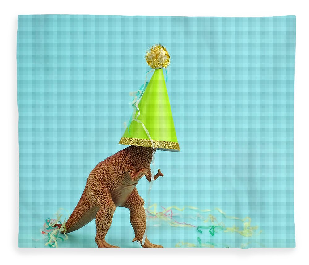 Celebration Fleece Blanket featuring the photograph Toy Dinosaur Wearing A Party Hat by Juj Winn