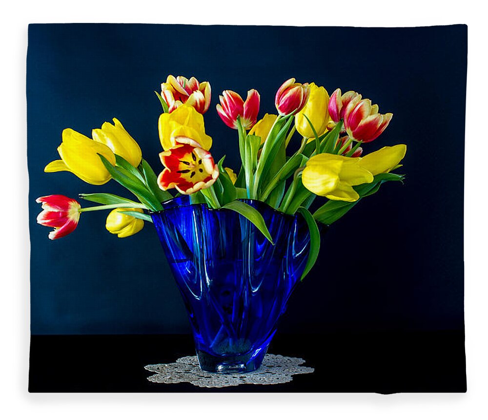 Tulips In Blue Fleece Blanket featuring the photograph Tulips in Blue by Torbjorn Swenelius