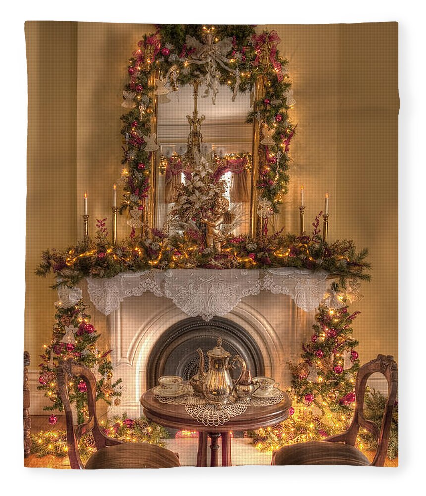 Inside; Indoors; Interior; Christmas; Wood; Rug; Victorian; Decorations; Ornaments; Lights; Seasonal; Season; Holiday; Table; Chairs; Tea; Tea Set; Cup; Saucer; Mirror; Fireplace; Still Life; Garland; Candles; Lights; Decore Fleece Blanket featuring the photograph Victorian Christmas by the Fire by Margie Hurwich