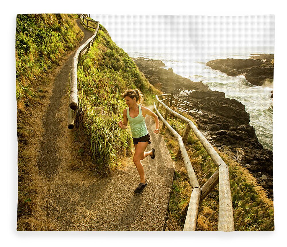Curve Fleece Blanket featuring the photograph Woman Running For Exercise by Jordan Siemens
