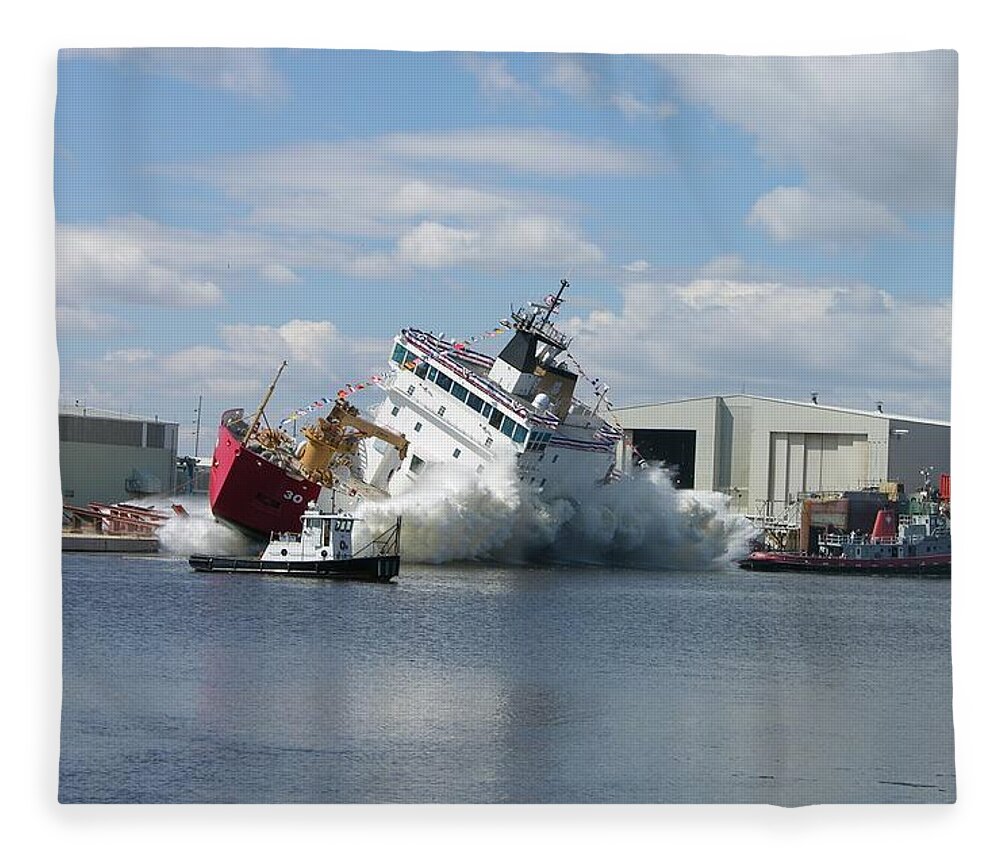Mackinaw Fleece Blanket featuring the photograph Splash launch of the Coast Guard Cutter Mackinaw by Keith Stokes