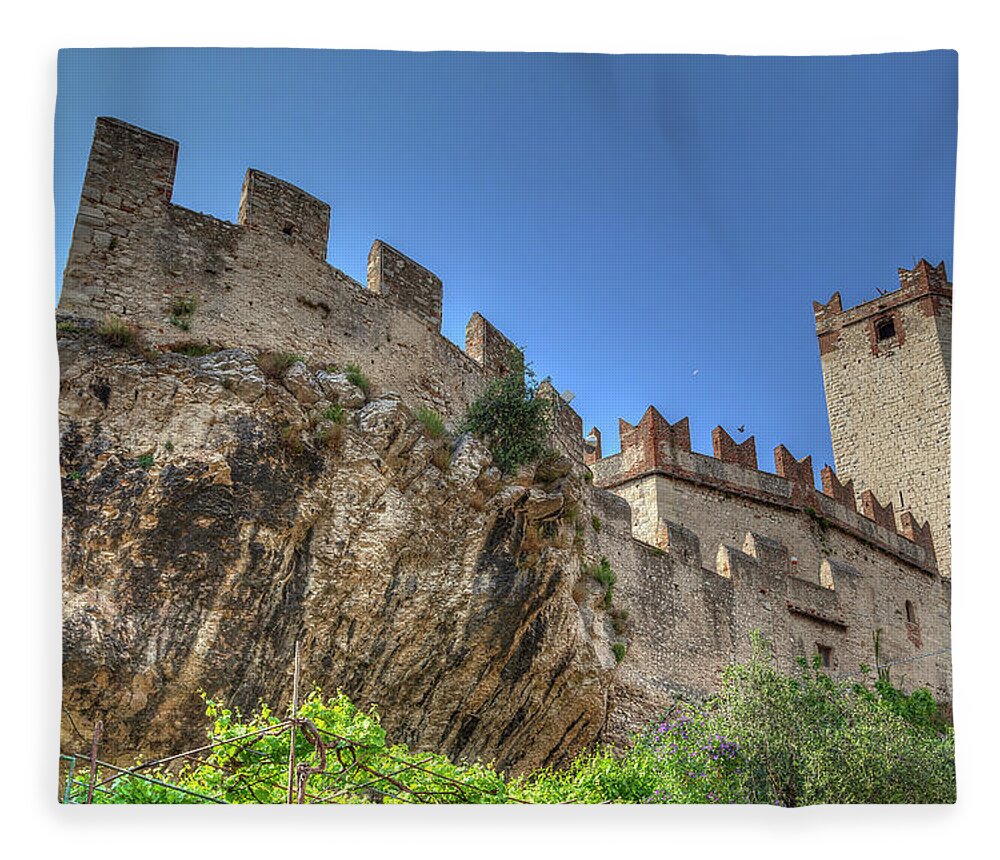 Architecture Fleece Blanket featuring the photograph the Scaliger Castle n the historical old town of the charming village Malcesine #1 by Gina Koch