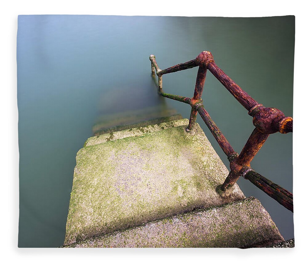 Railing Fleece Blanket featuring the photograph Rusty Handrail Going Down On Water #2 by Mikel Martinez de Osaba