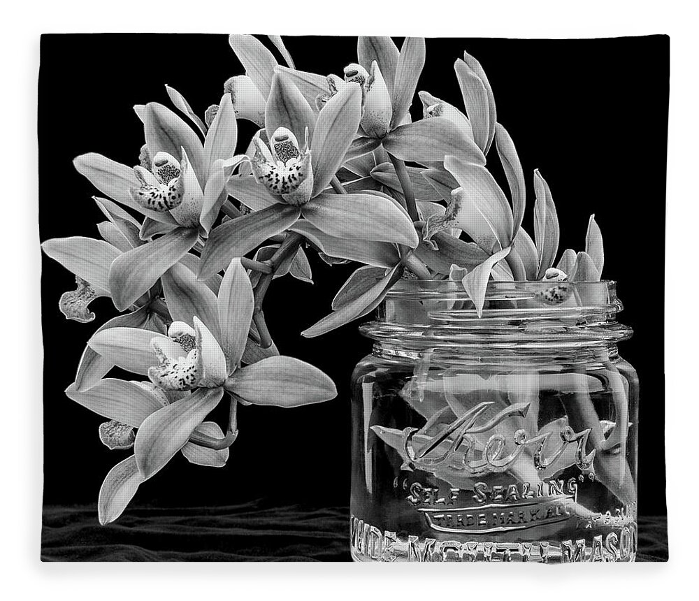 Orchid Fleece Blanket featuring the photograph Black and White Orchid Antique Mason Jar by Kathy Anselmo