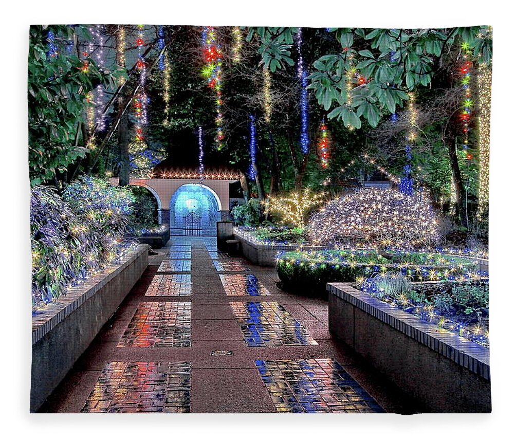 Alex Lyubar Fleece Blanket featuring the photograph Christmas illuminations in the Tilford Gardens by Alex Lyubar