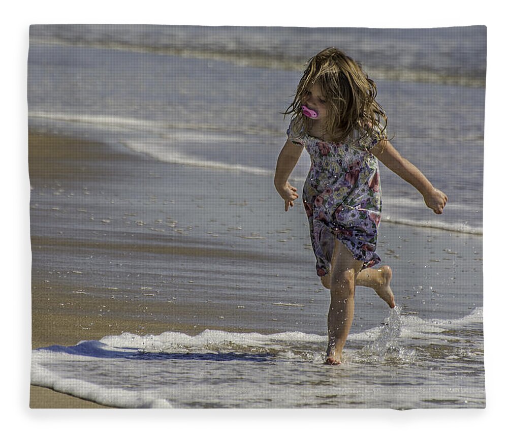 Dancing Fleece Blanket featuring the photograph Dancing in the surf with a pink pacifier by WAZgriffin Digital