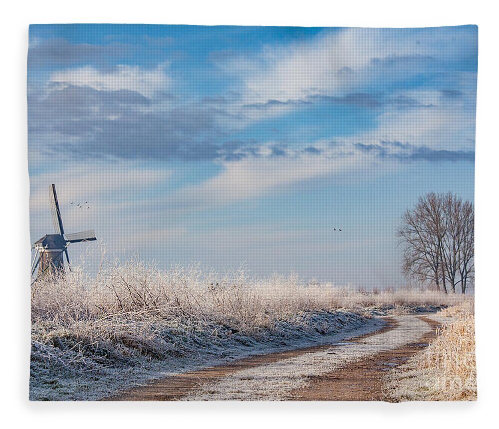 Holland Fleece Blanket featuring the photograph Dutch windmill in winter by Casper Cammeraat