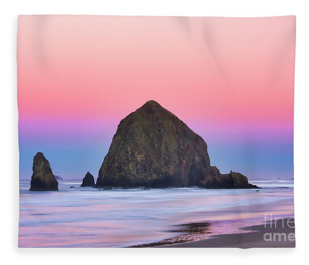 Haystack Rock Fleece Blanket featuring the photograph Haystack Rock at dawn by Bruce Block
