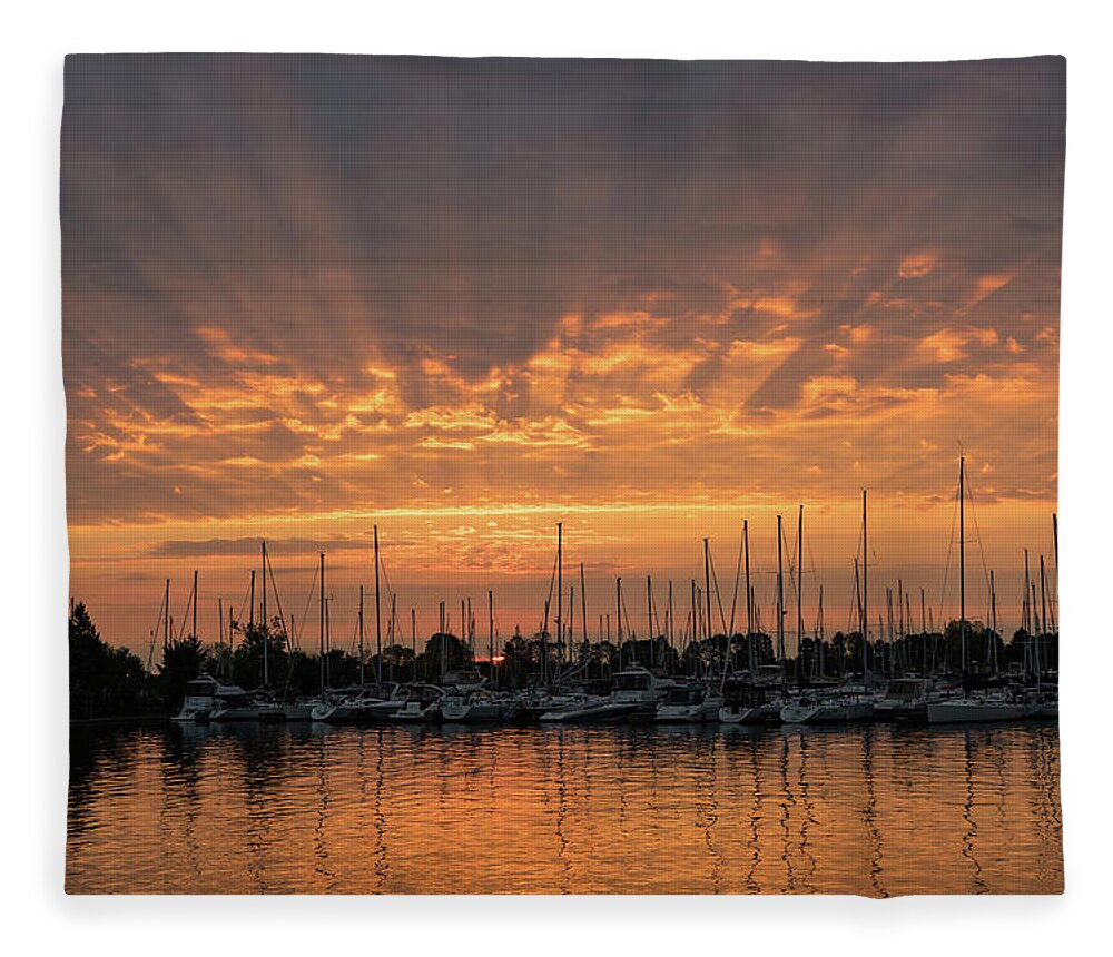 God Rays Fleece Blanket featuring the photograph Just a Sliver of the Sun - Sunrise God Rays at the Marina by Georgia Mizuleva