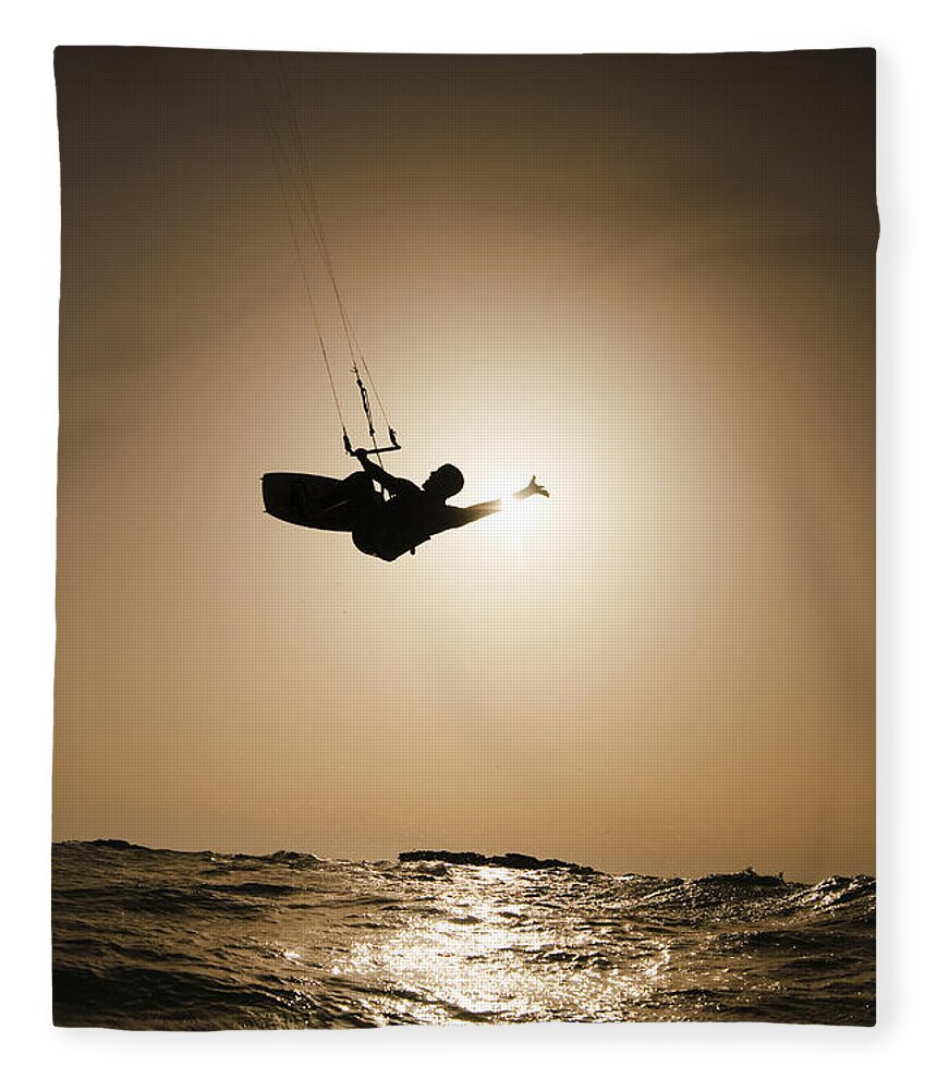 Kitesurfing Fleece Blanket featuring the photograph Kitesurfing at sunset by Hagai Nativ