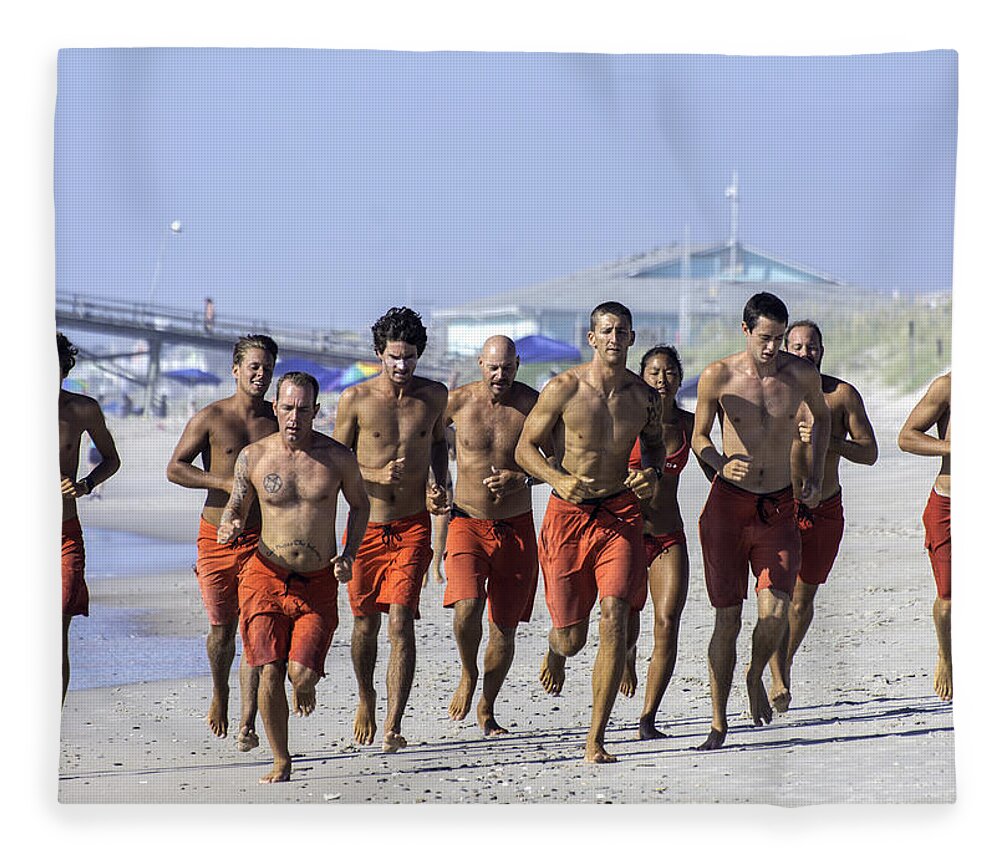  Life Guard Fleece Blanket featuring the photograph Kure Beach Life guards on the run by WAZgriffin Digital