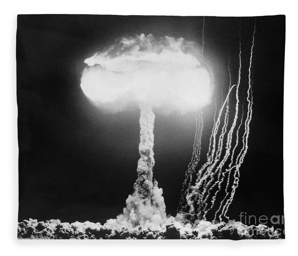 1950s Fleece Blanket featuring the photograph Mushroom Cloud At Nevada Test Site by H Armstrong Roberts ClassicStock