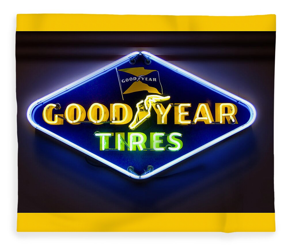 Transportation Fleece Blanket featuring the photograph Neon Goodyear Tires Sign by Mike McGlothlen