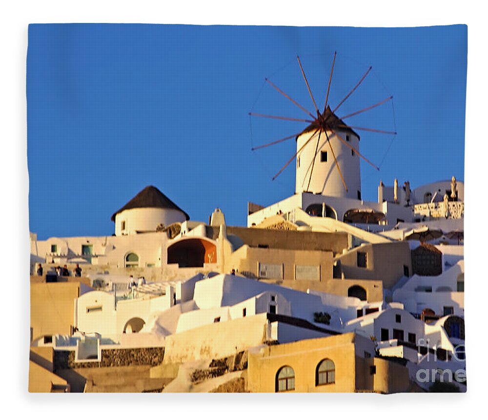 Santorini Fleece Blanket featuring the photograph Oia Windmill by Jeremy Hayden