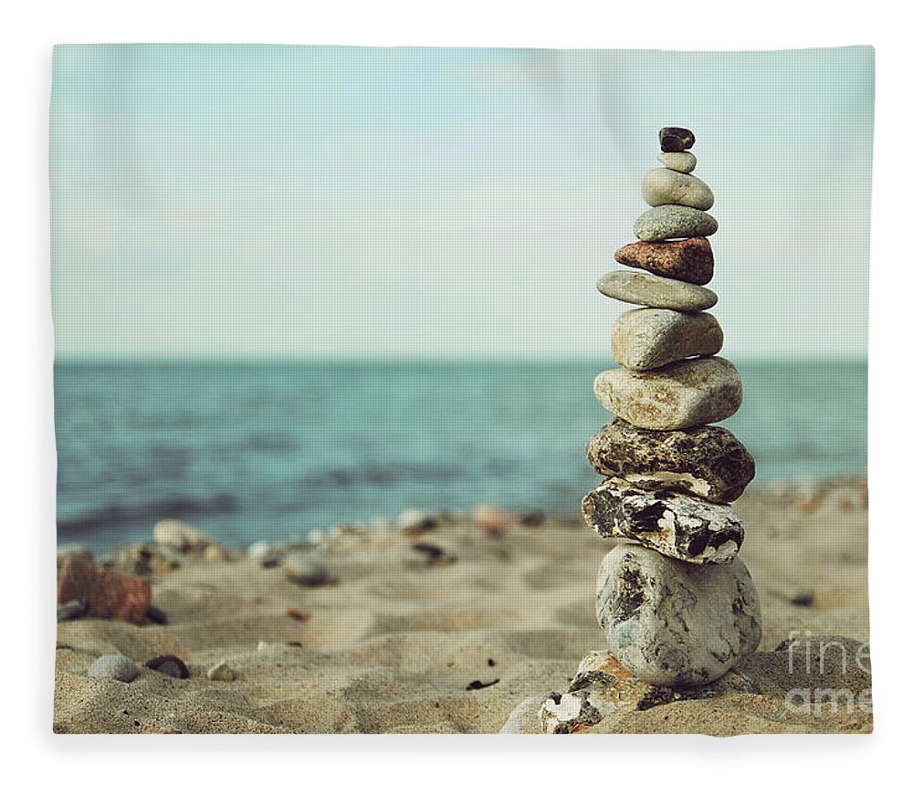 Stones Fleece Blanket featuring the photograph Poised by Hannes Cmarits