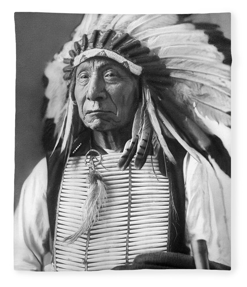 Red Fleece Blanket featuring the photograph Red Cloud, Dakota Chief, wearing a headdress, 1880s by David Frances Barry